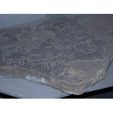 Clay tablet with solar cross symbol